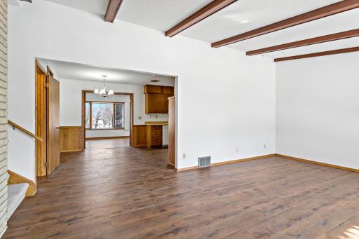 New flooring throughout main level. From living room, looking through kitchen to sunroom.