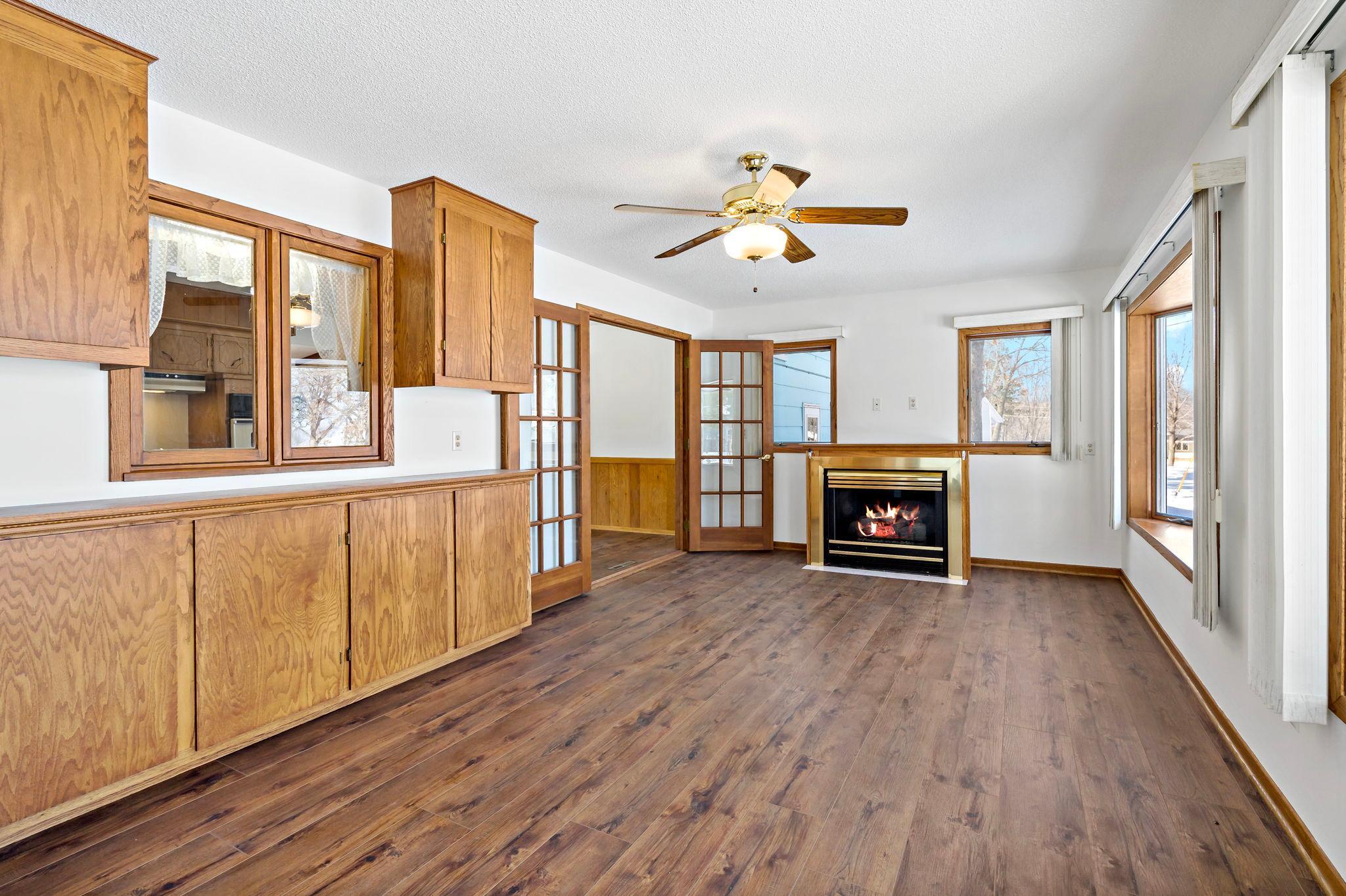 Sunroom also has a gas fireplace! French doors from kitchen.