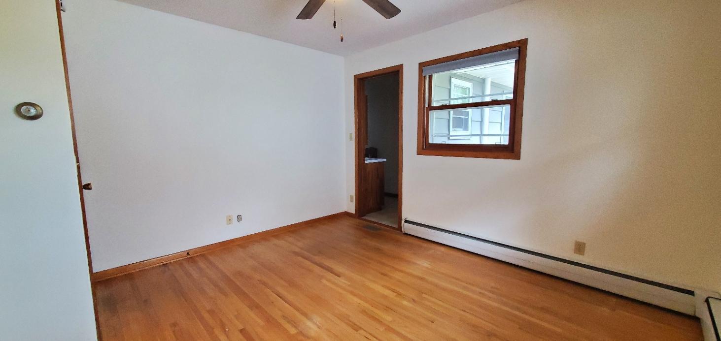 Primary bedroom with half bath