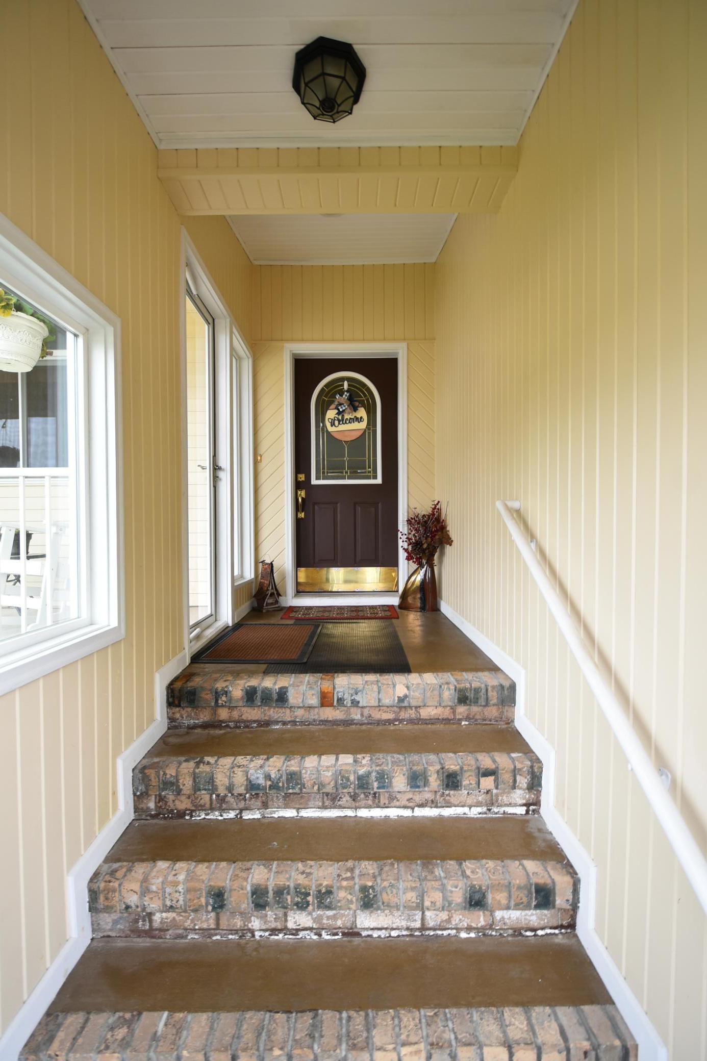 Enclosed front entry-visitors are out of the elements!