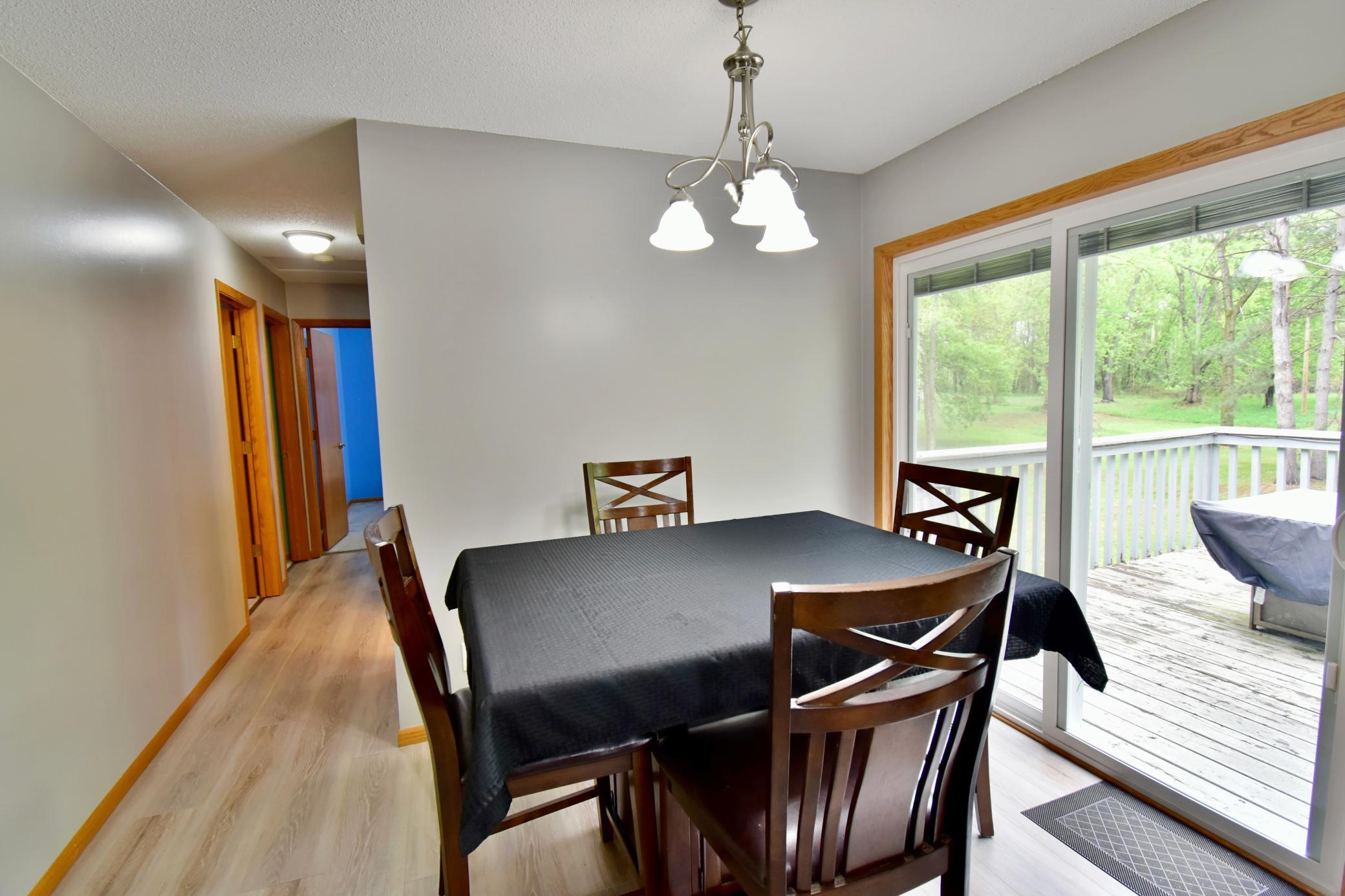 The dining area leads to the three bedrooms on this main floor.