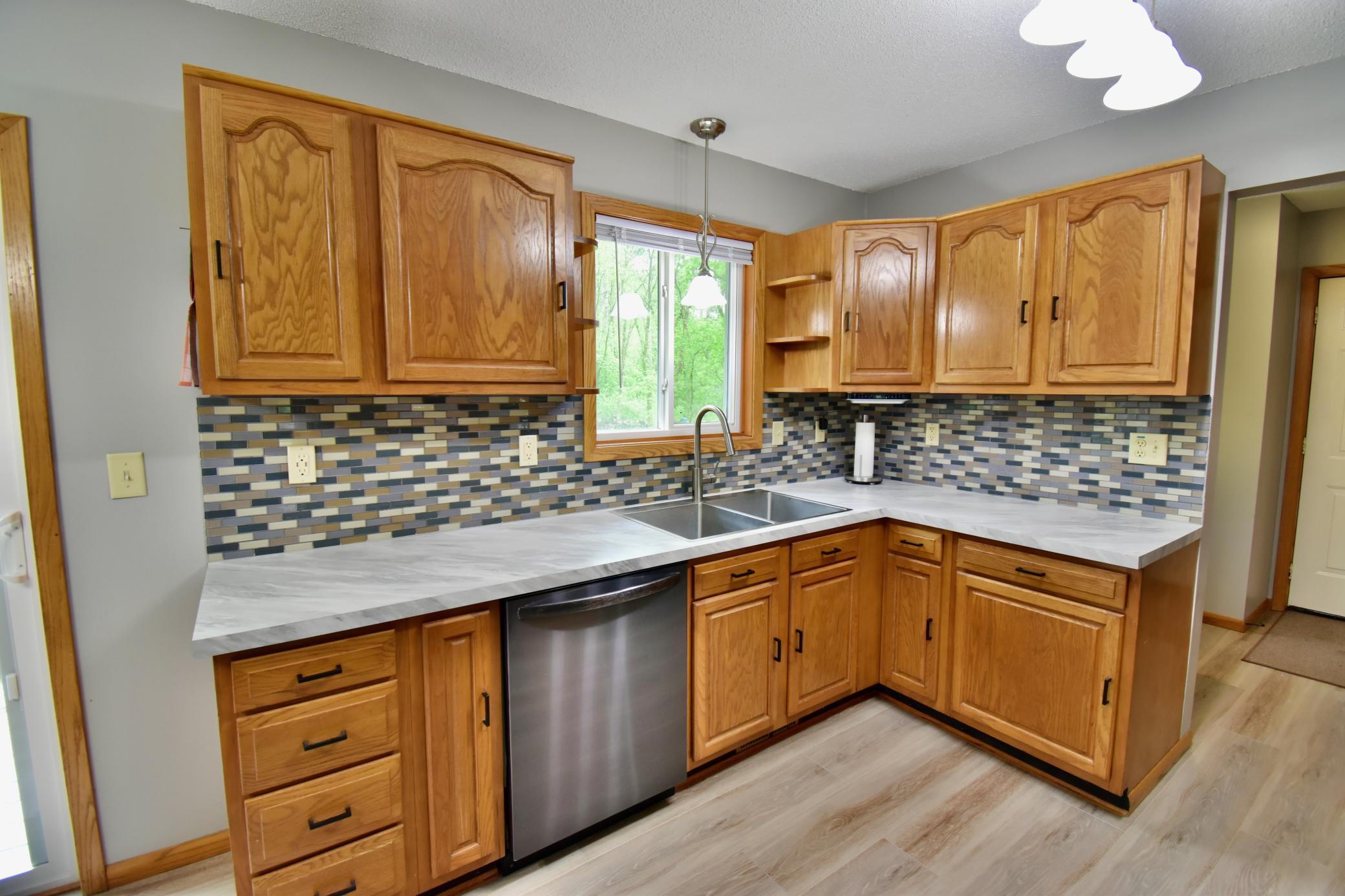 The window over the sink allows you to view the large back yard and gives you lots of natural light in this busy area of the home.