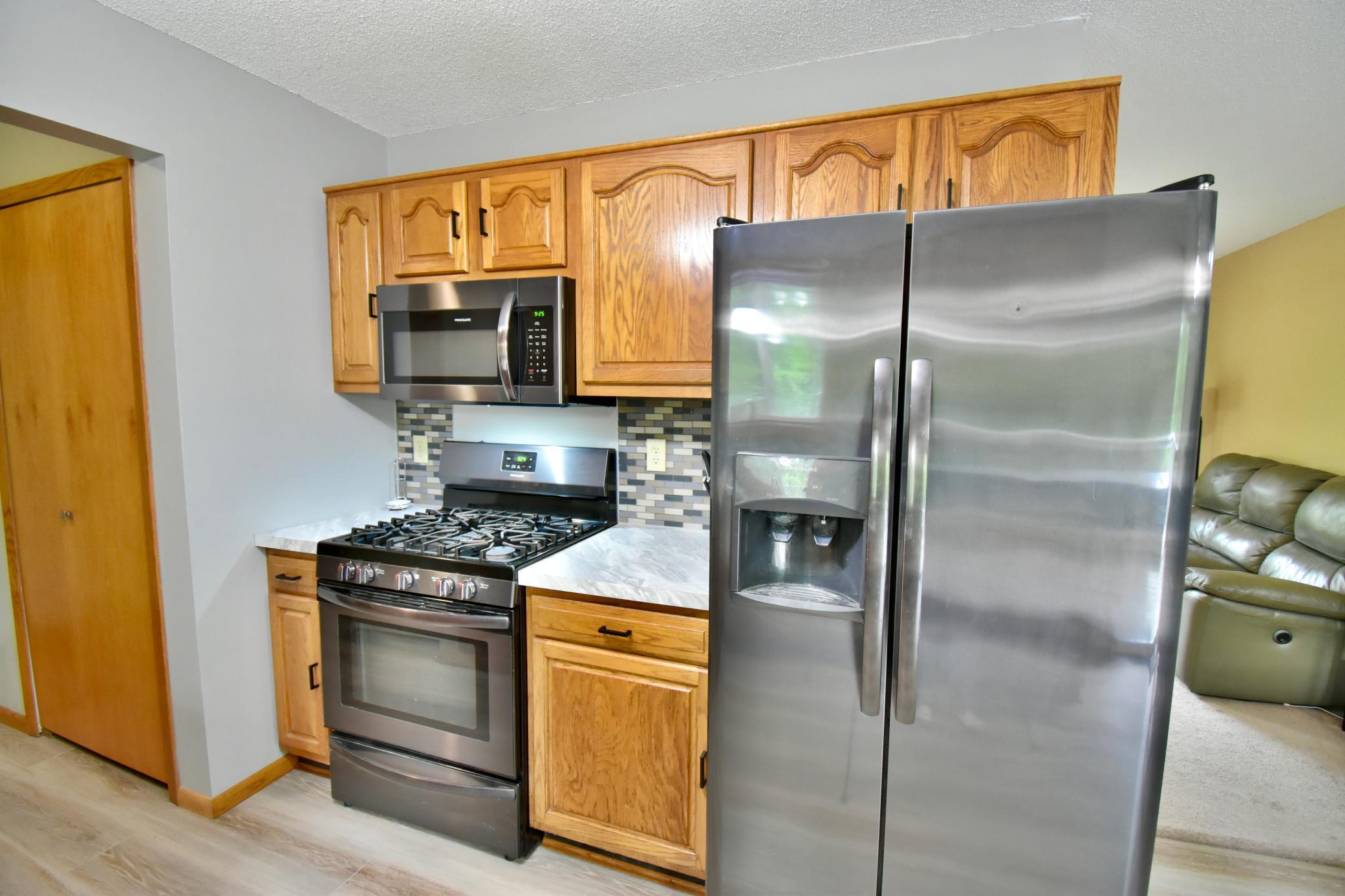 Lots of cabinet space, a pantry and stainless steel appliances add to the kitchen.