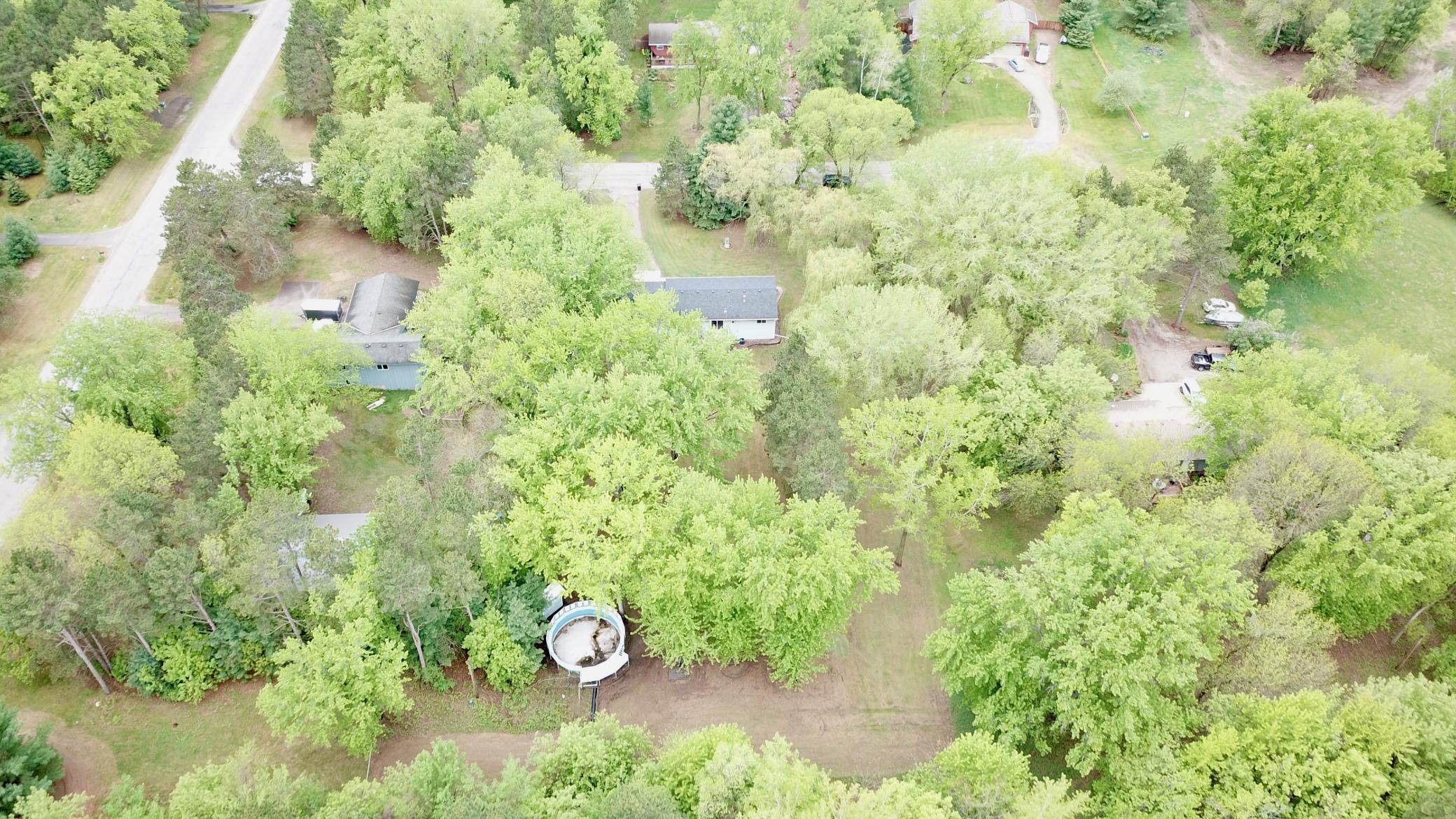 Aerial view showing the swimming pool. There is no liner in the pool currently but can be added, filled with water and up and running if the buyer wants it.