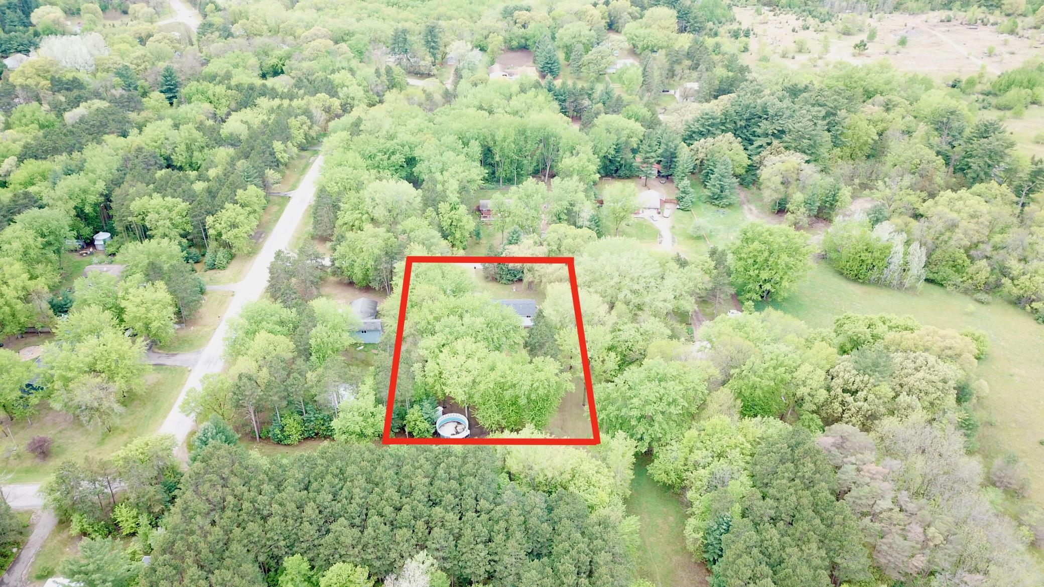 Sitting on over an acre of land and has a nicely wooded lot to provide privacy. Line is approximate.