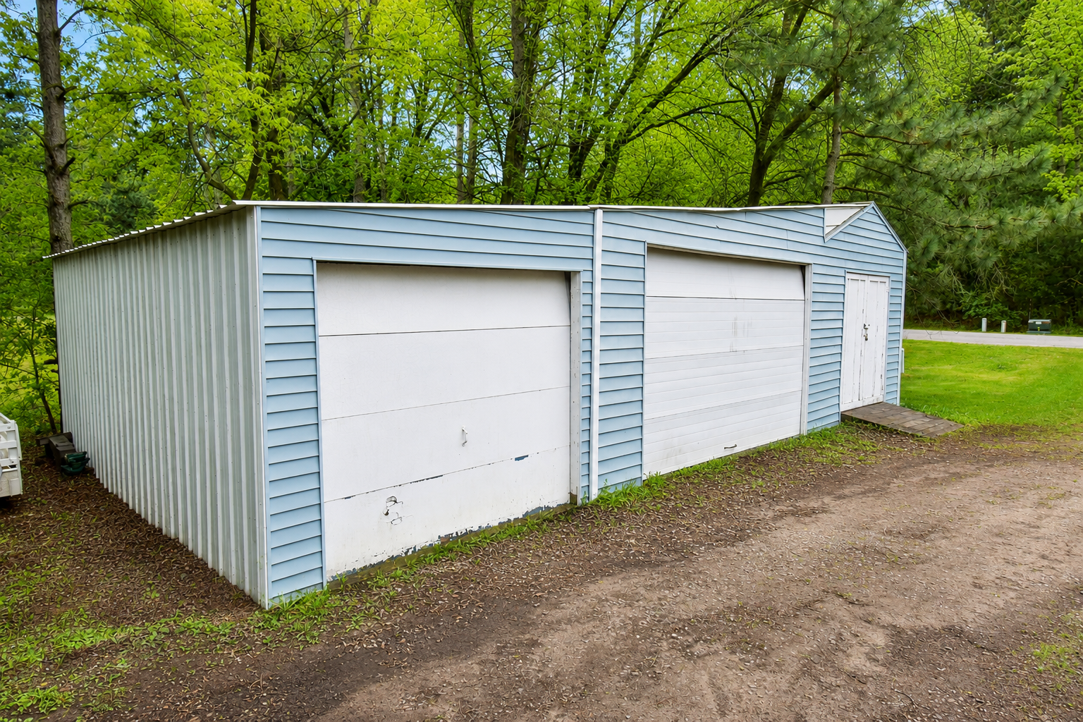 Besides the attached 2 car garage you'll find more garage/storage space in these additional stalls.