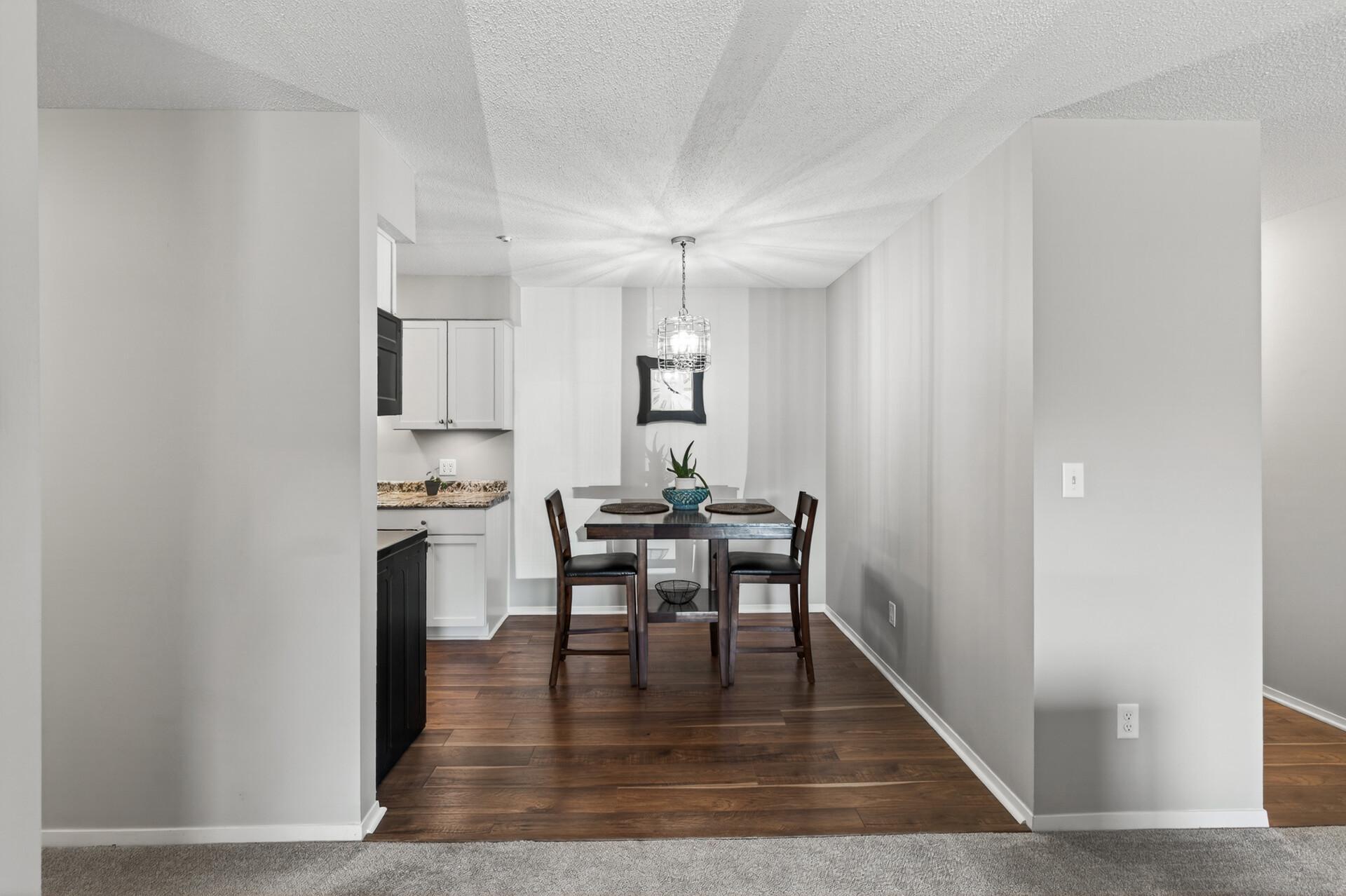 The dining area feels bright and inviting, with a simple layout that keeps the kitchen and living room nicely connected.