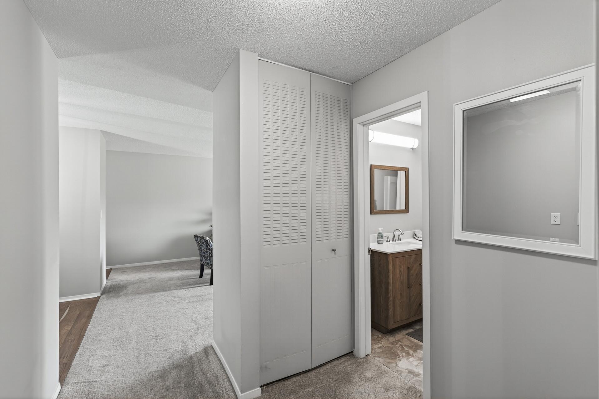 Smart hallway layout connects the bedrooms, bath, kitchen, dining area, and living room, with a convenient linen closet for extra everyday storage.