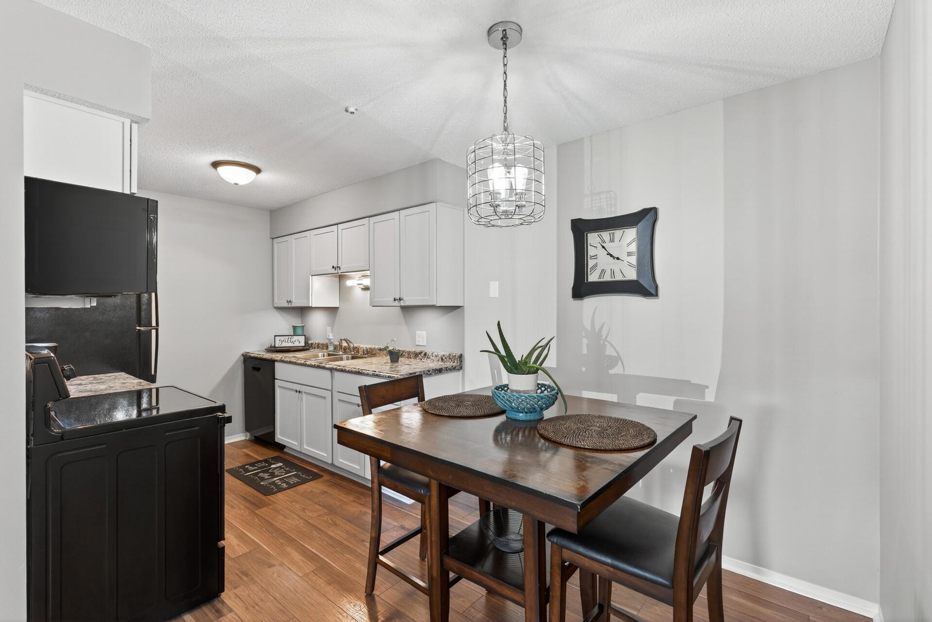 The kitchen and dining area offer a simple, functional layout with space to gather, dine, and stay connected to the main living area.