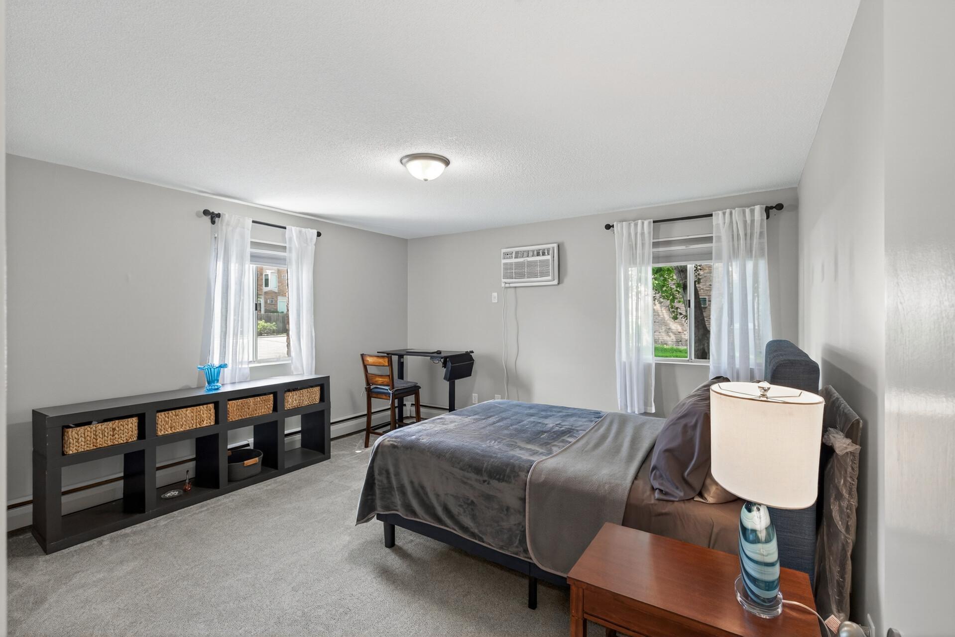 A spacious primary bedroom gives you room for more than just sleeping, with space for a work desk or sitting area and an oversized closet for added storage.