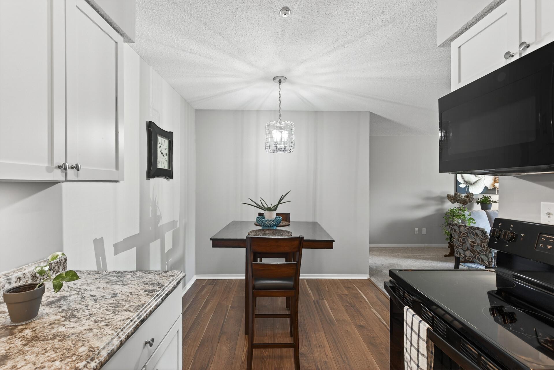 The kitchen and dining area offer a simple, functional layout with space to gather, dine, and stay connected to the main living area.
