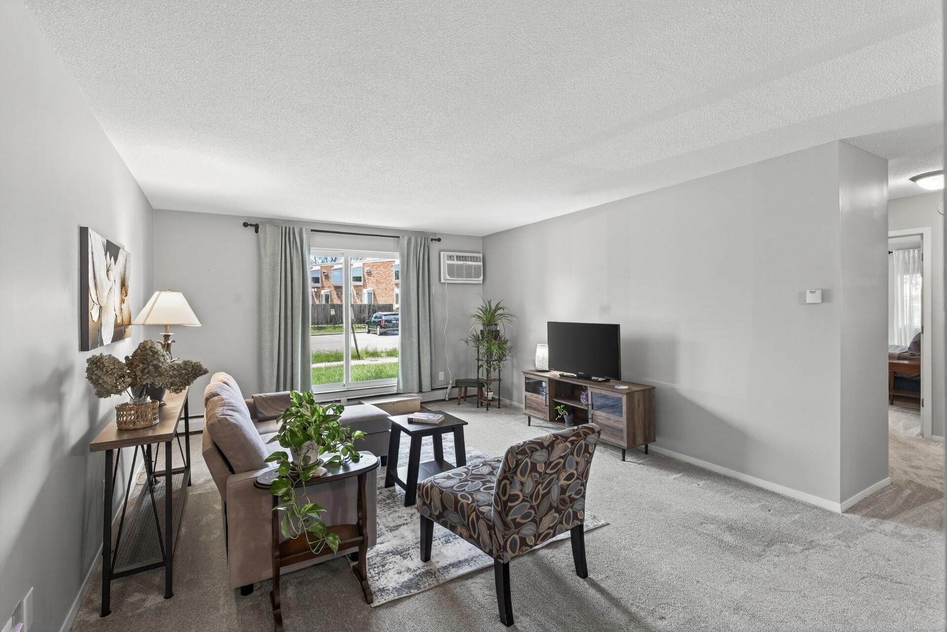 Welcome to this spacious 2-bedroom, 1-bath ground-level condo with a large walk-out patio that gives it a townhome-like feel. Enjoy a generous living space, no-charge community laundry, and amenities including a saltwater pool and sauna.