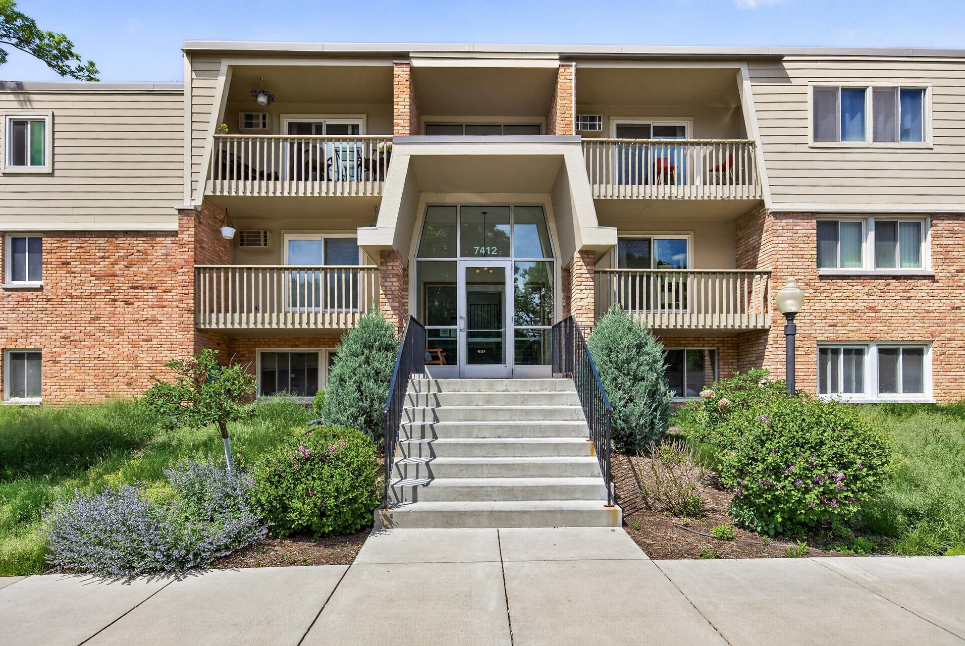 Welcome to 7412 West 22nd Street, a ground-level walkout condo designed for simple, easy living. Enjoy a townhome-like feel with patio access, green space, blooming flowers, and community amenities including a saltwater pool, sauna, and party room.
