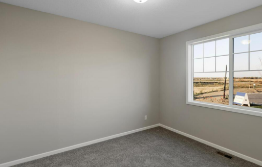 Bedroom 2 PHOTO OF A DIFFERENT HOME WITH SIMILAR PLAN. FINISHES MAY VARY.