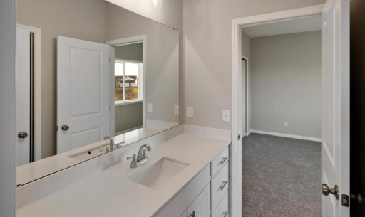 Jack & Jill Bath PHOTO OF A DIFFERENT HOME WITH SIMILAR PLAN. FINISHES MAY VARY.