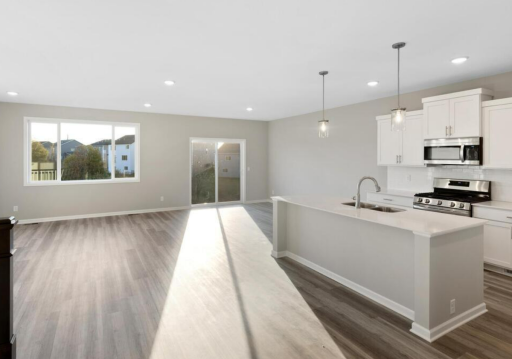 PHOTO OF A DIFFERENT HOME WITH SIMILAR PLAN. FINISHES MAY VARY.