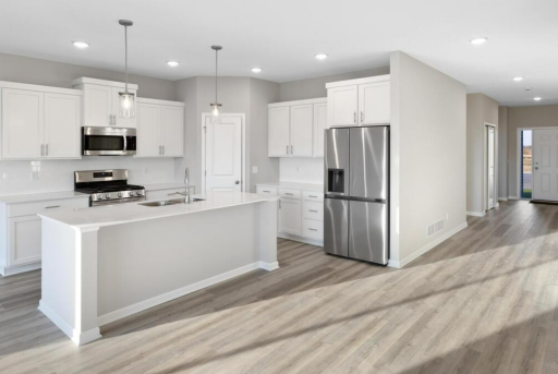 PHOTO OF A DIFFERENT HOME WITH SIMILAR PLAN. FINISHES MAY VARY.