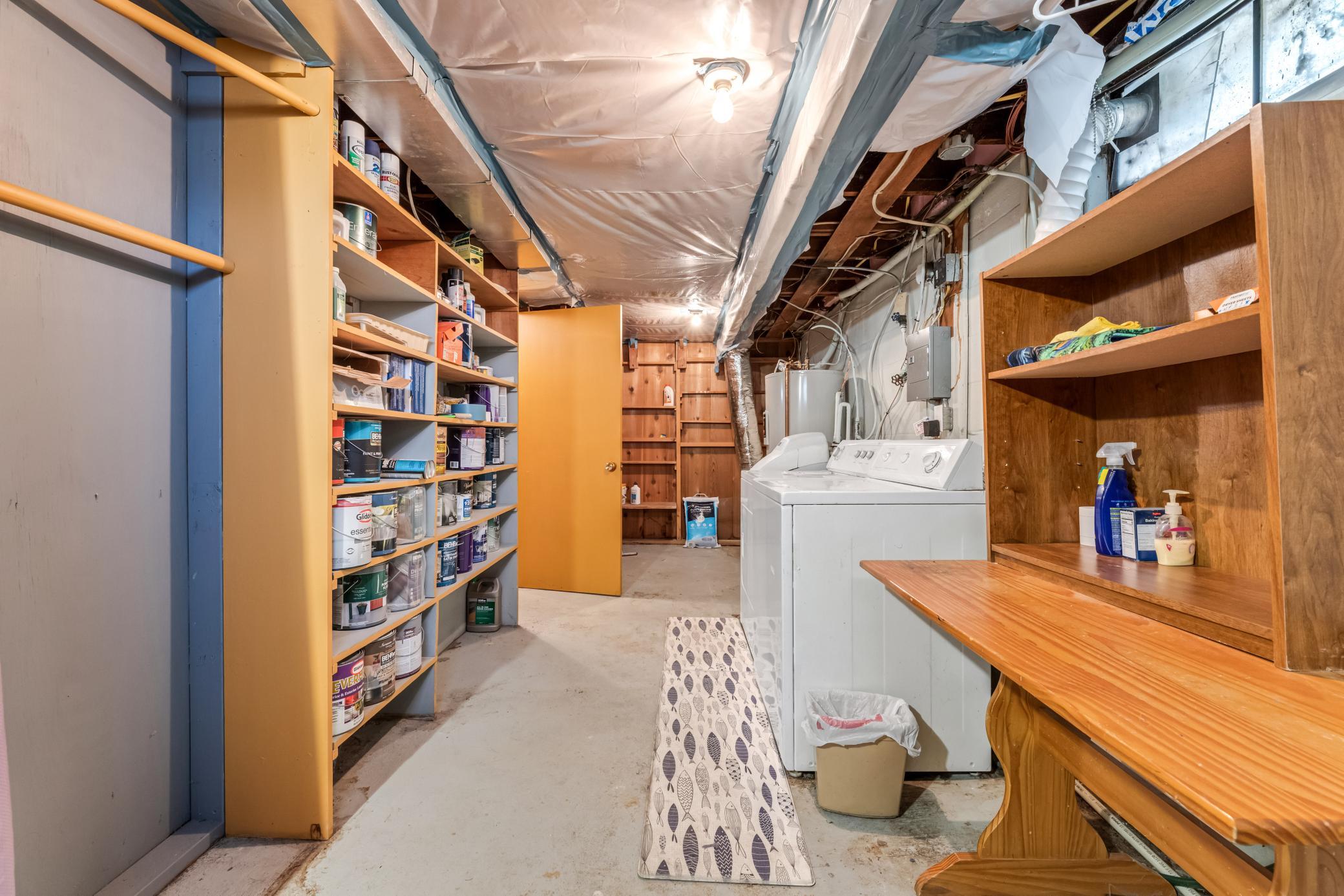 Lower level laundry with lots of shelving