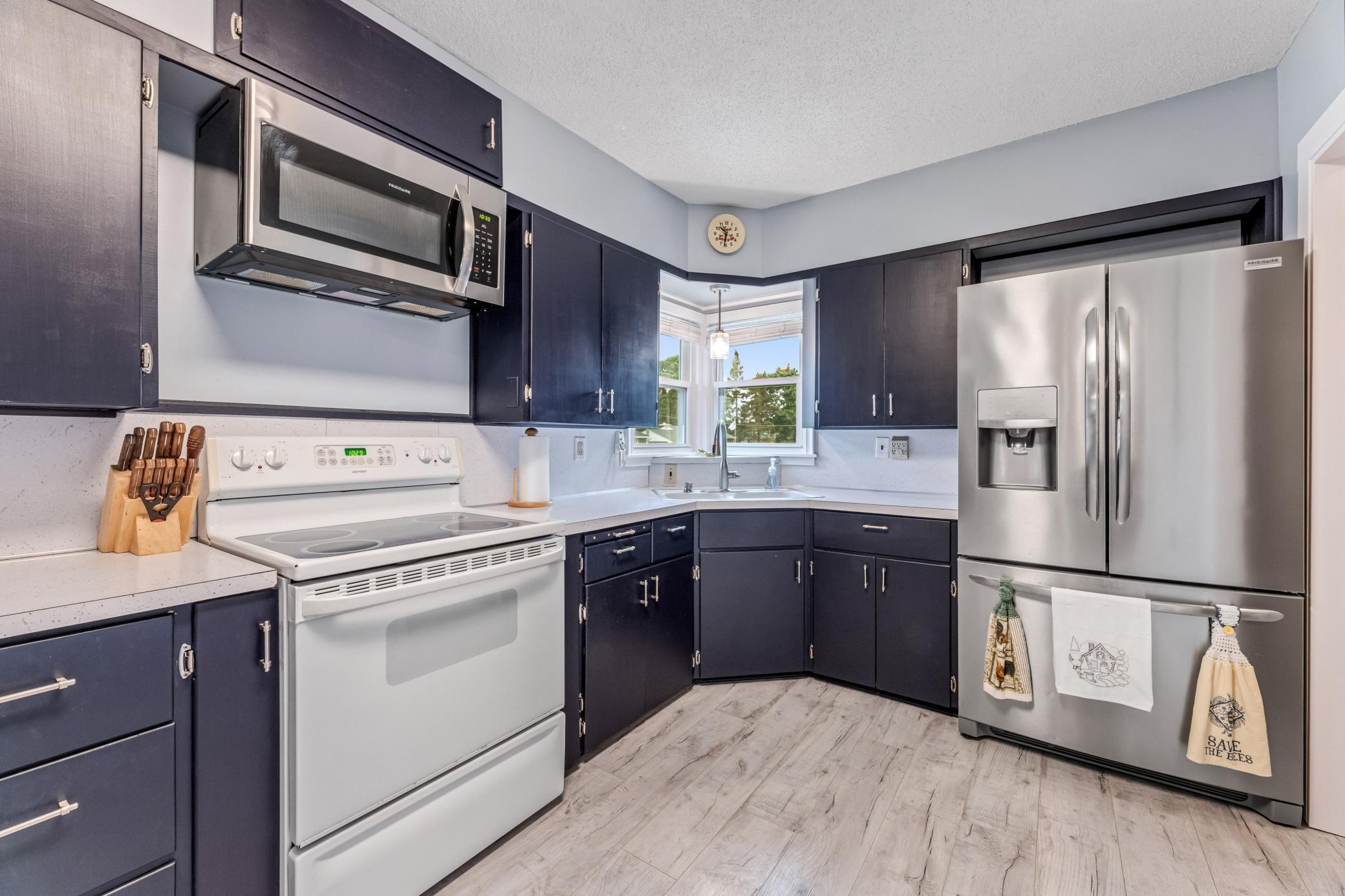 Stainless fridge and microwave.
