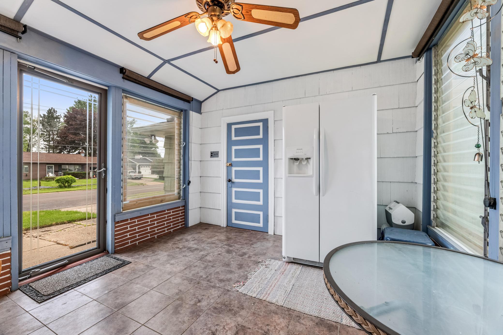 This sunny breezeway could be a mudroom or a fun porch to read in