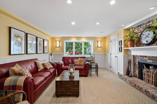 Head down to the lower level family room with cozy wood burning fireplace