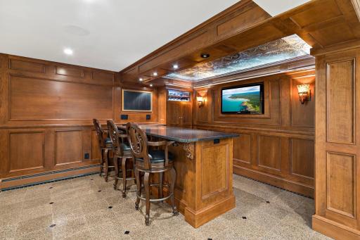 Lower level Irish Pub Bar with bar seating and intricate ceiling details