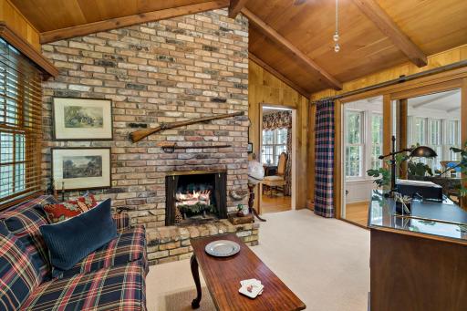 Wood burning fireplace and floor to ceiling brick surround