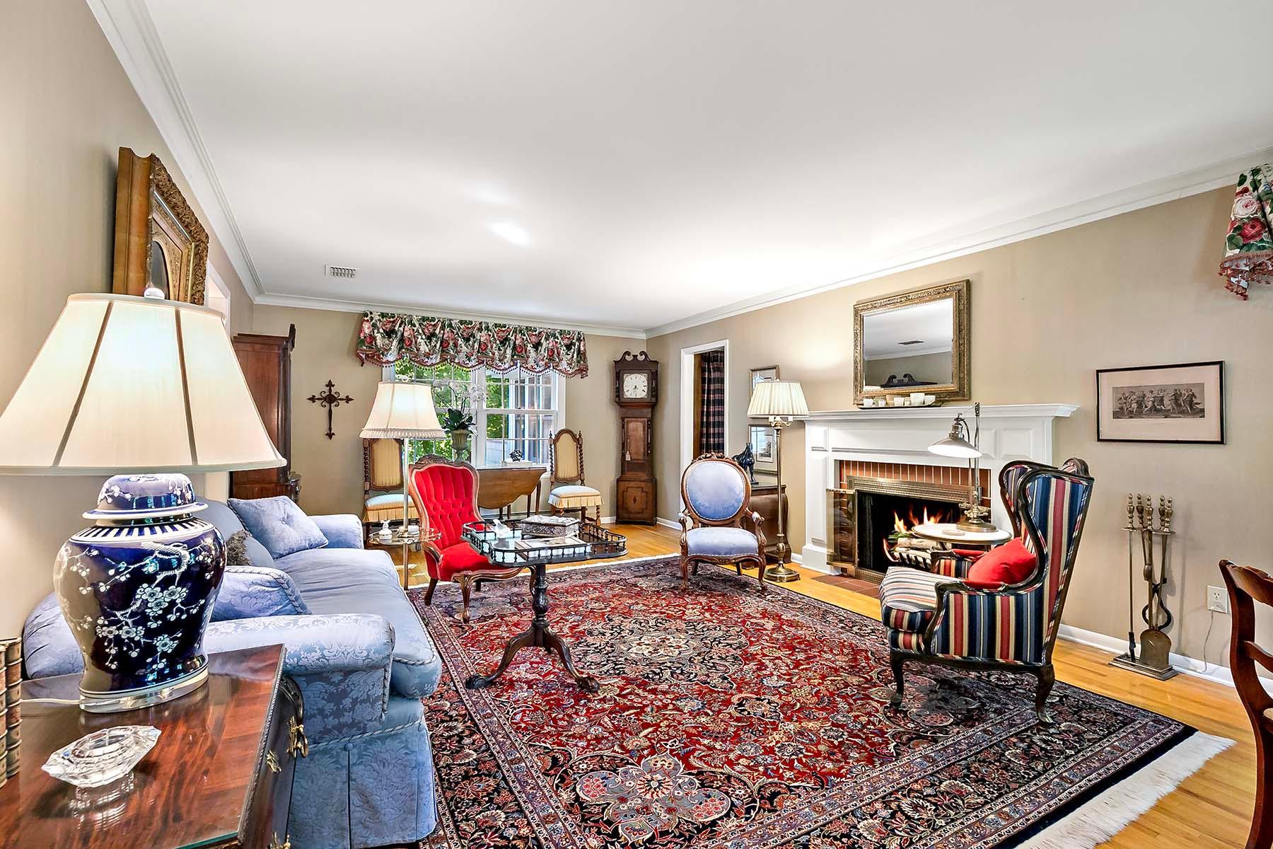 Formal living room with a wood burning fireplace