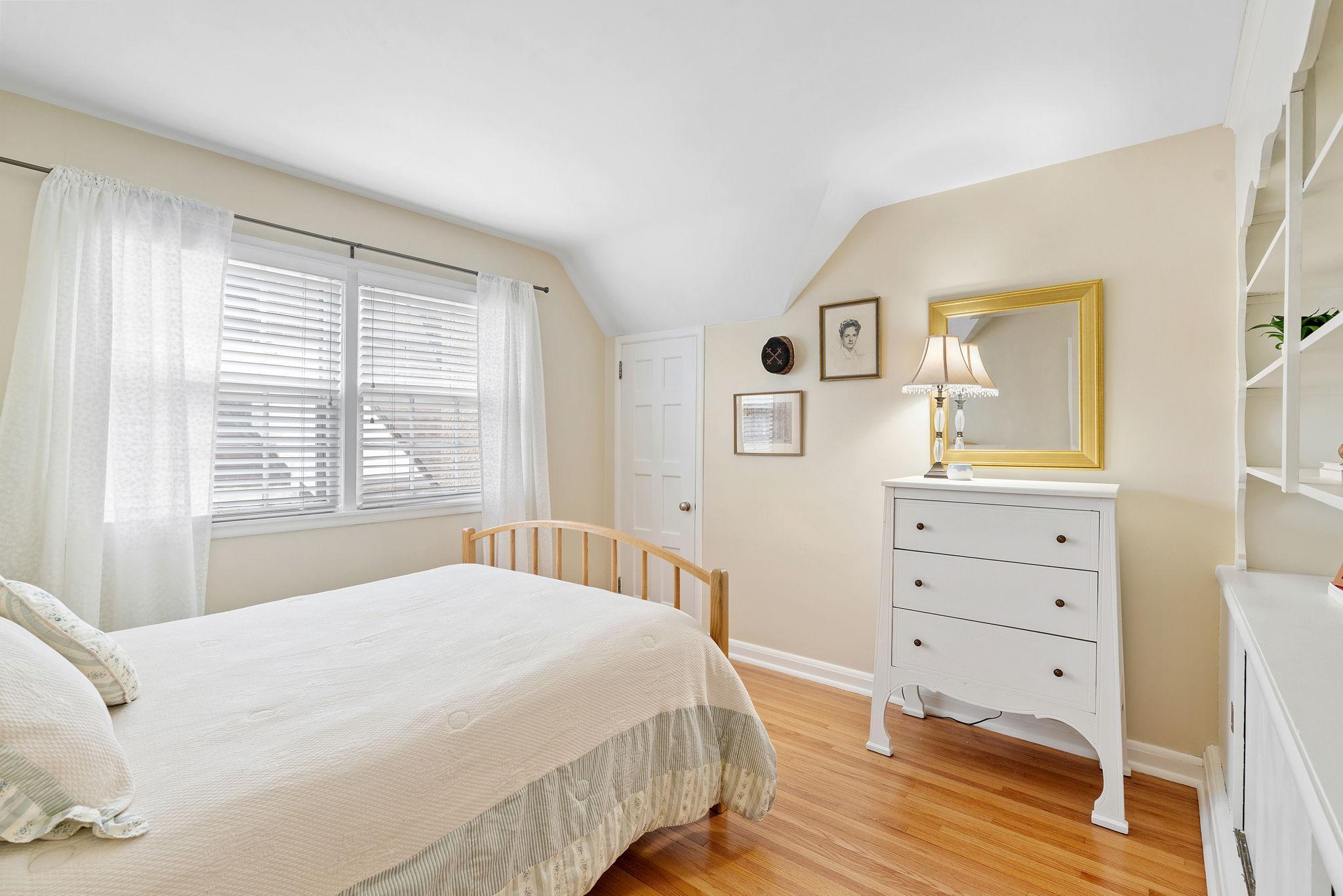 Second bedroom also features wood floors