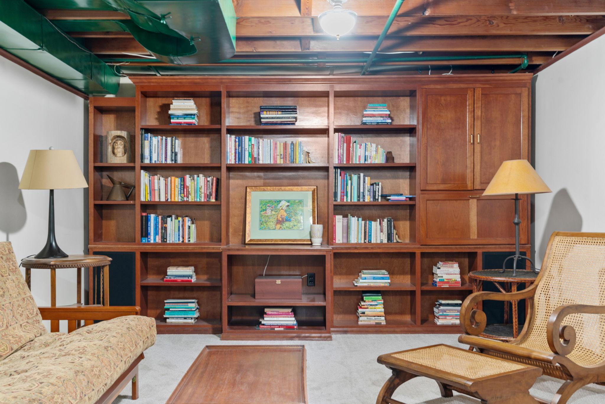 Fabulous full wall, custom built bookshelf that makes the space extra inviting