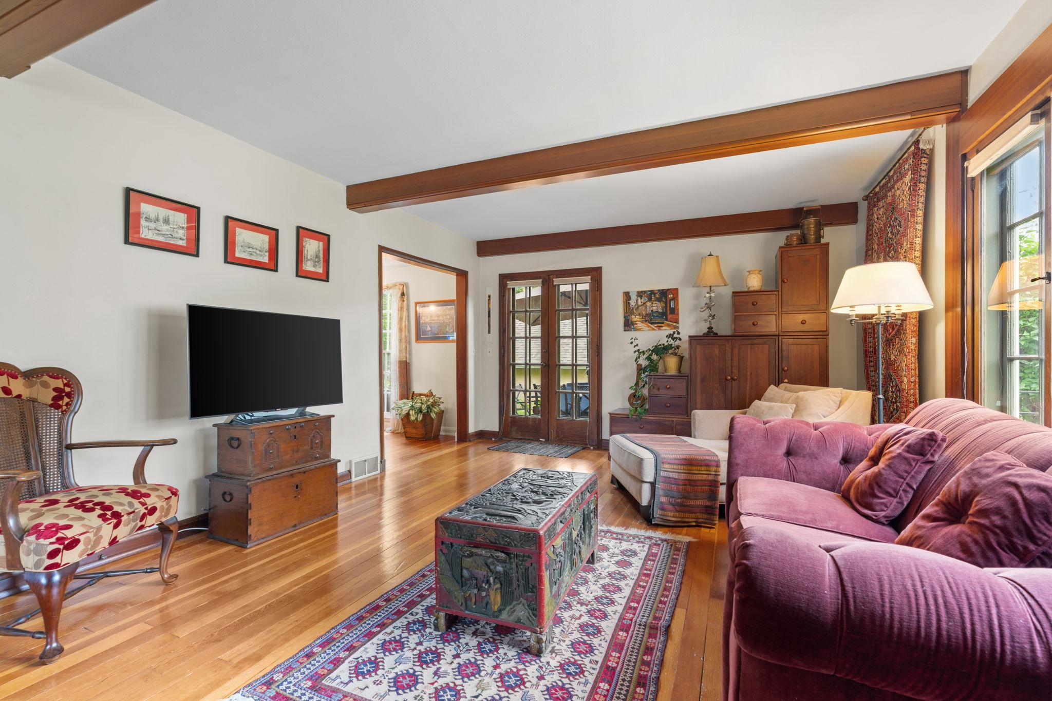 The wood beams add a touch or warmth and elegance to this space