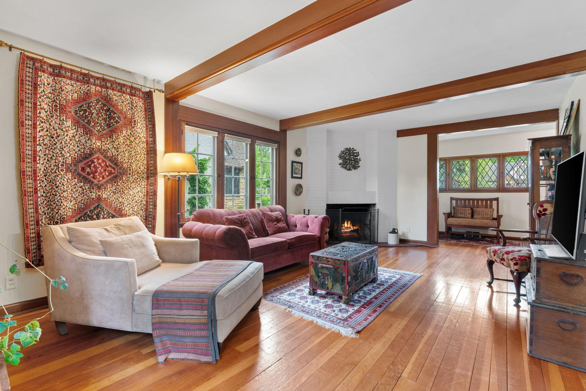 The living room is spacious and features wood floors
