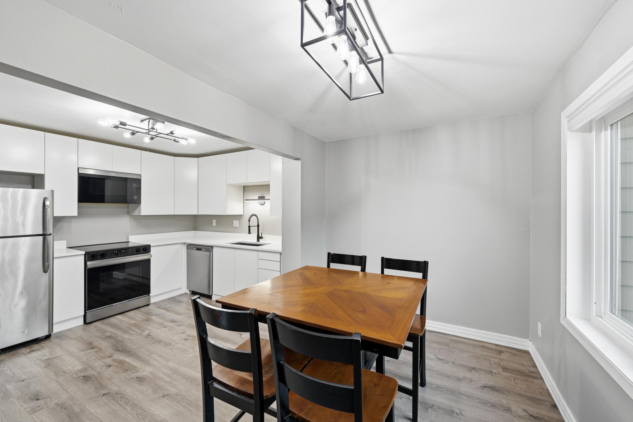 With the dining area open to the updated kitchen, entertaining guests is a breeze.