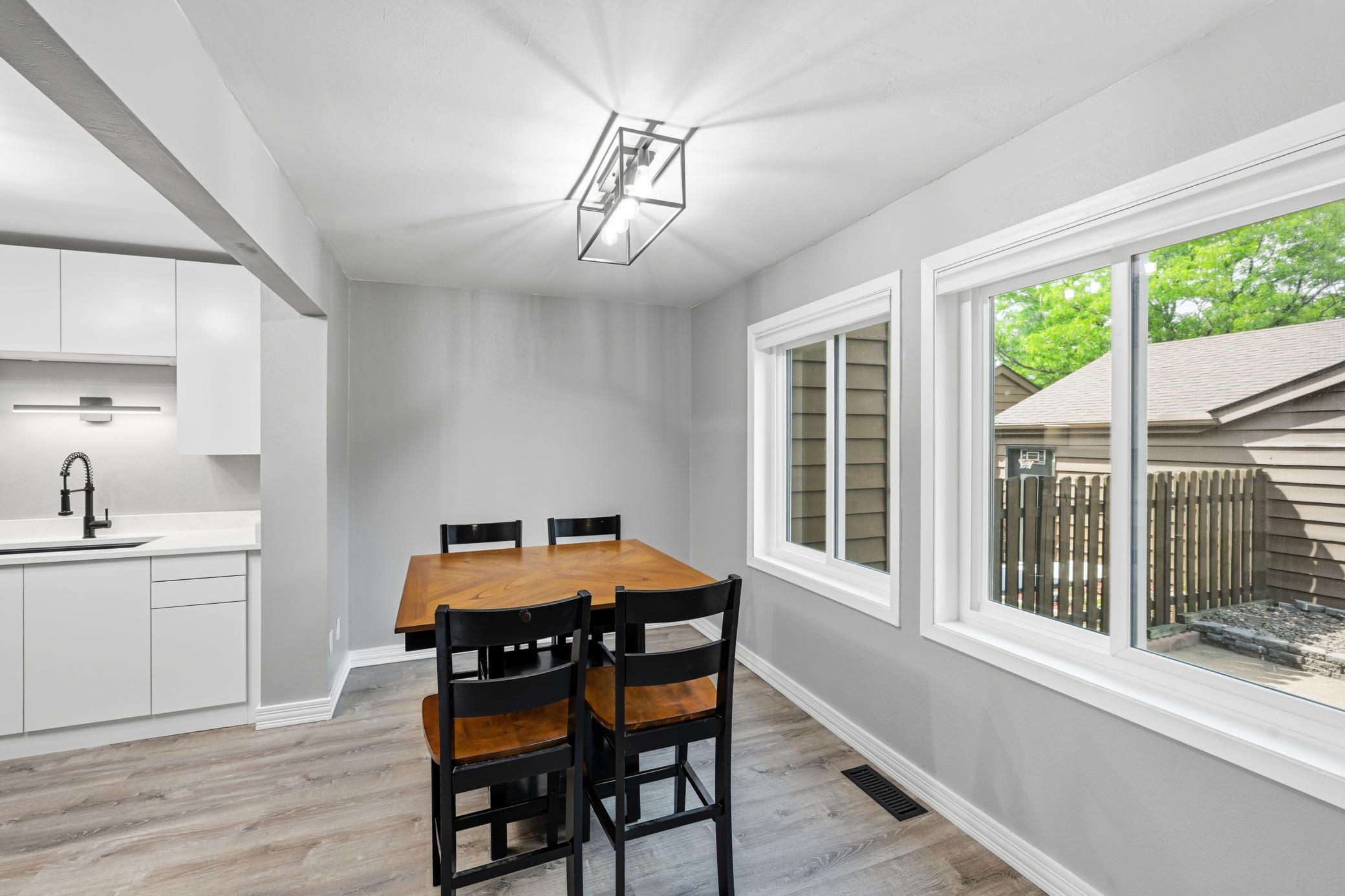 New windows and flooring make the dining area light and bright.