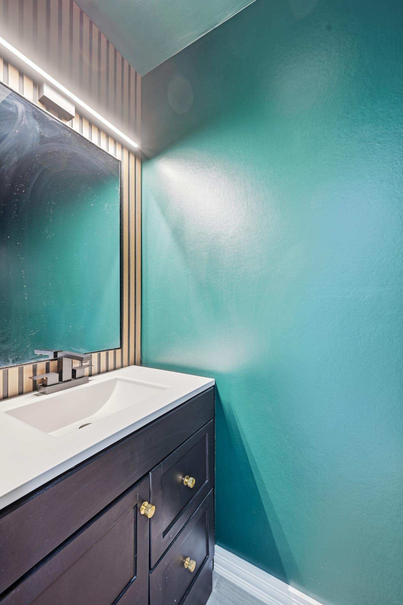Convenient half bath on the main level for guests.