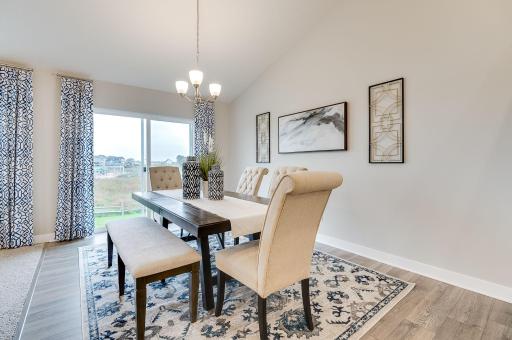 With dining space adjacent to the living room, no one gets left out of the conversation. **Pictures are of model home; actual finishes will vary.