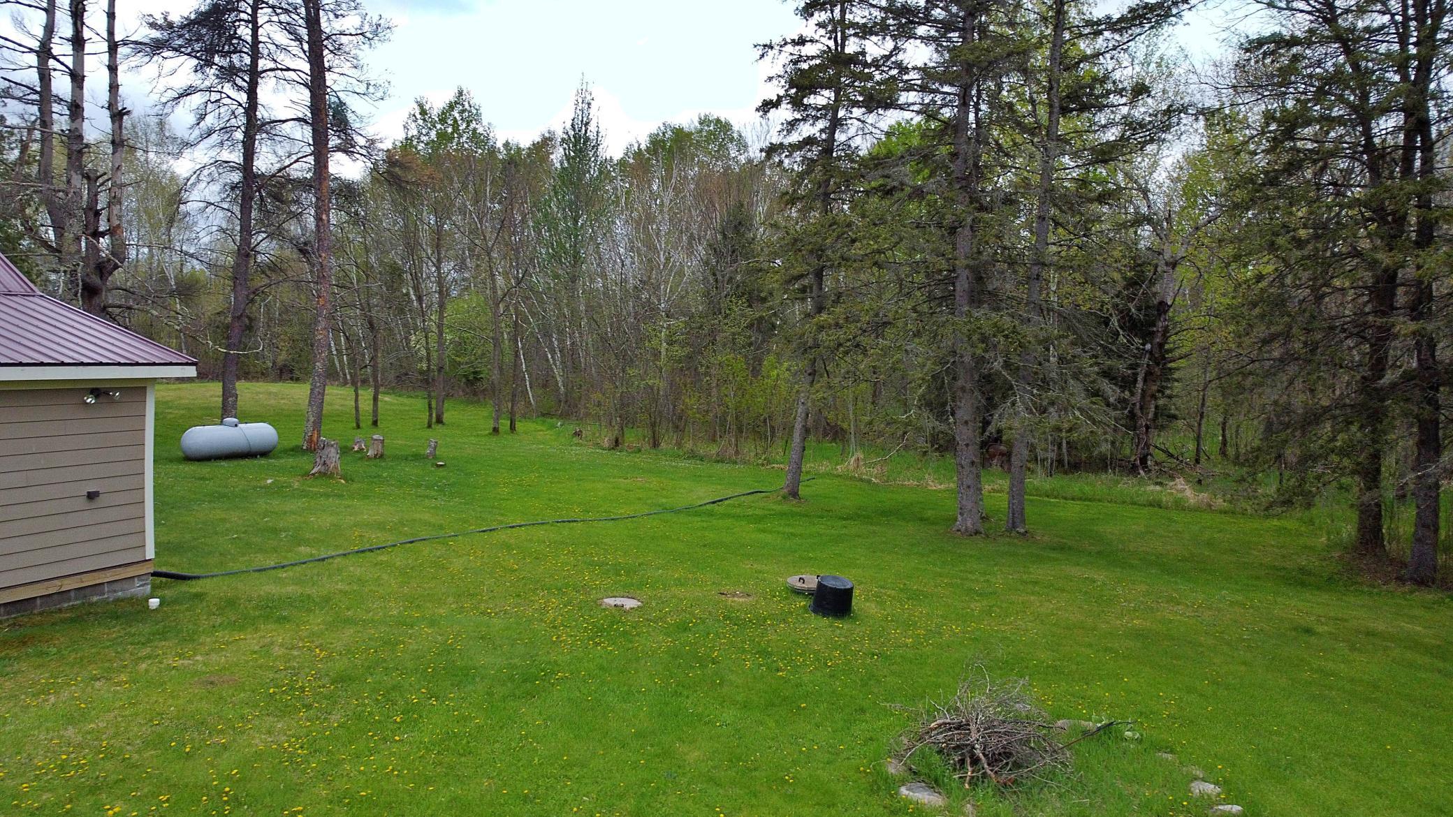 Grassy yard with fire pit.jpg