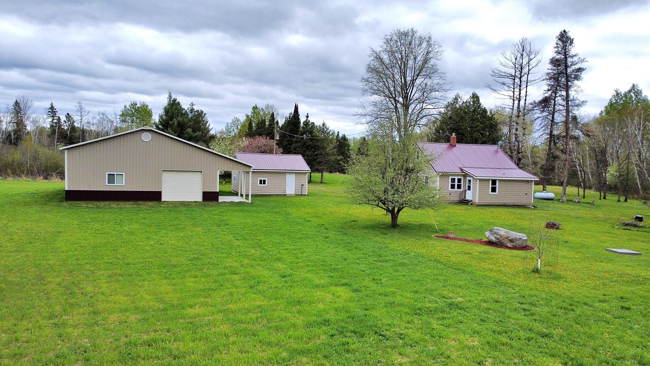 Property view of home garage and pole building 2.jpg