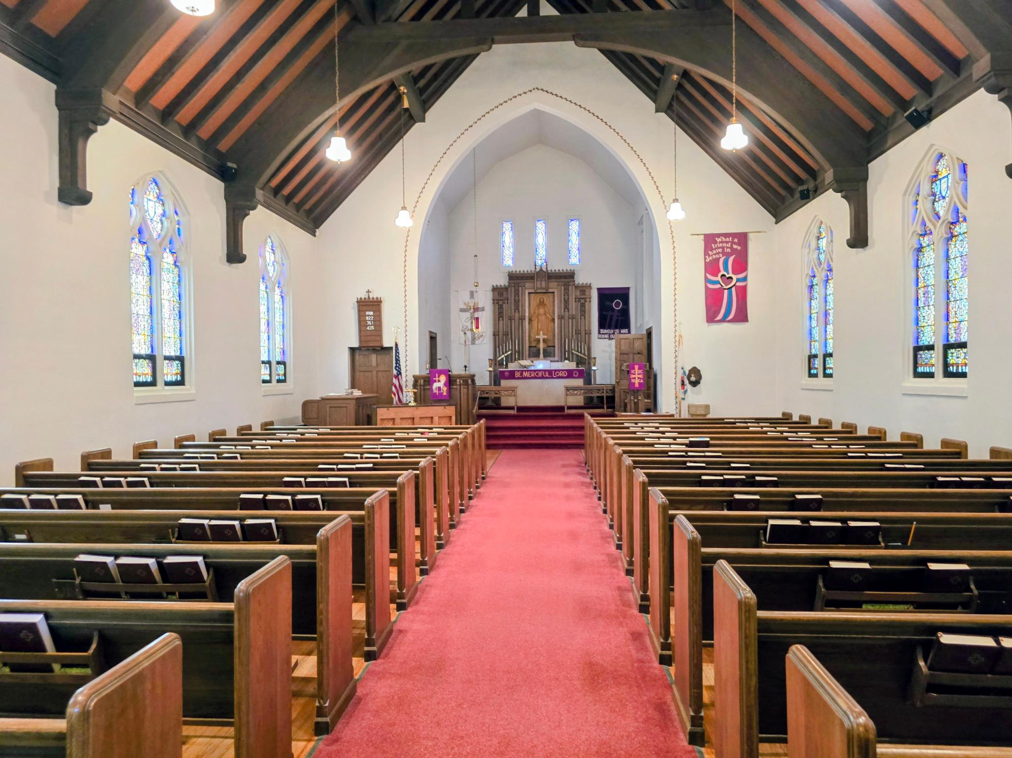 “Rich woodwork, soaring ceilings, and stunning German-made stained-glass windows create a truly unforgettable sanctuary space filled with warmth, beauty, and historic character.”