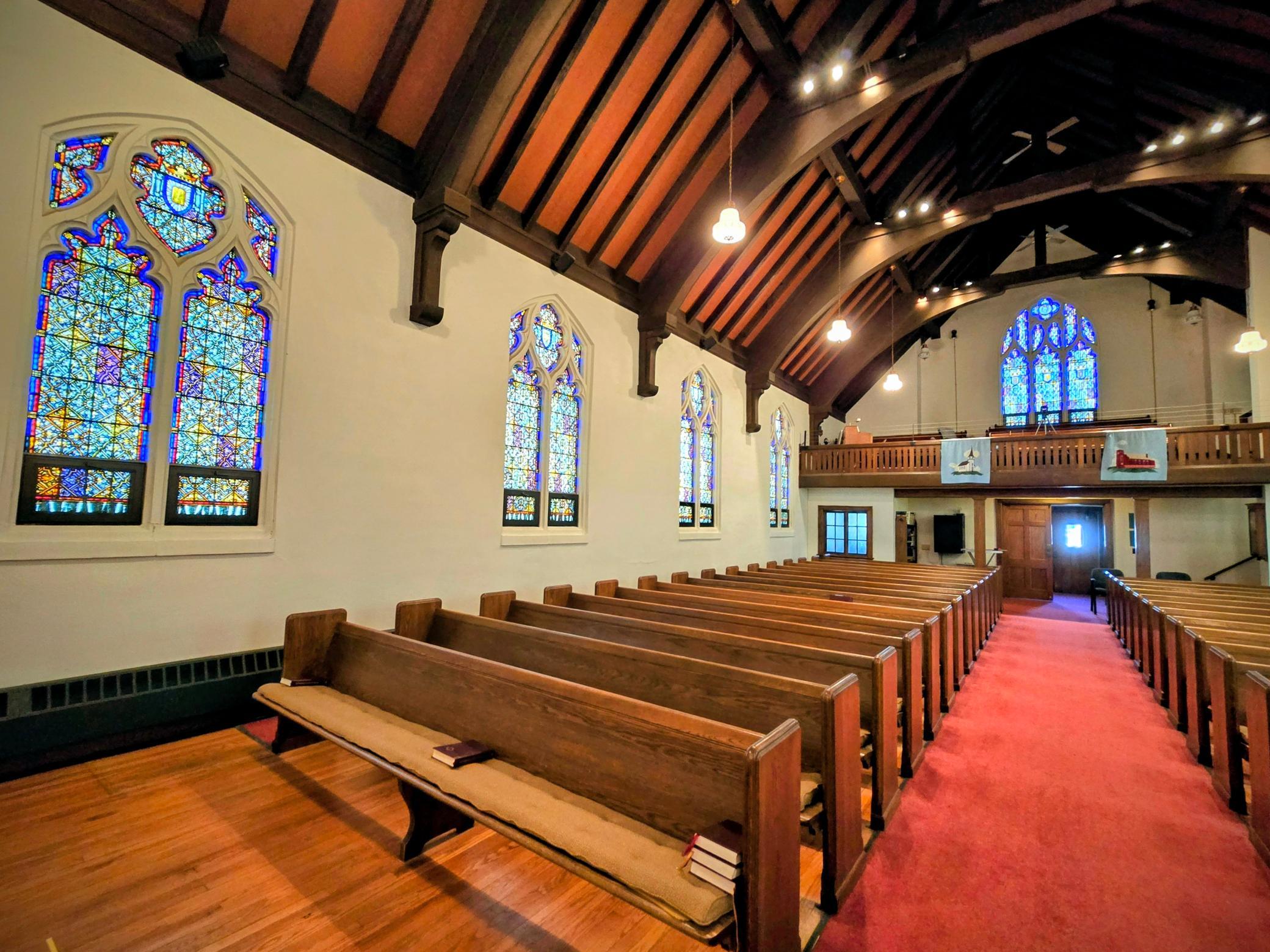“Beautiful stained-glass windows made in Germany add extraordinary architectural charm and natural light throughout the sanctuary.”