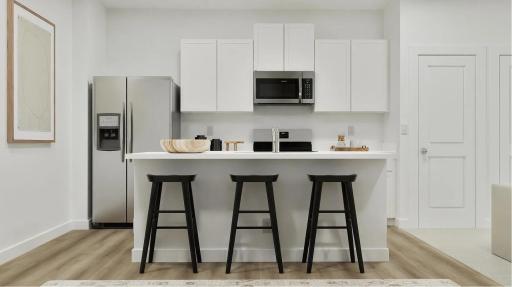 (Rendering, actual home's finishes will vary.) The modern kitchen offers access to culinary essentials for simple meal preparation, including new stainless steel appliances, stylish cabinetry and a convenient corner pantry.