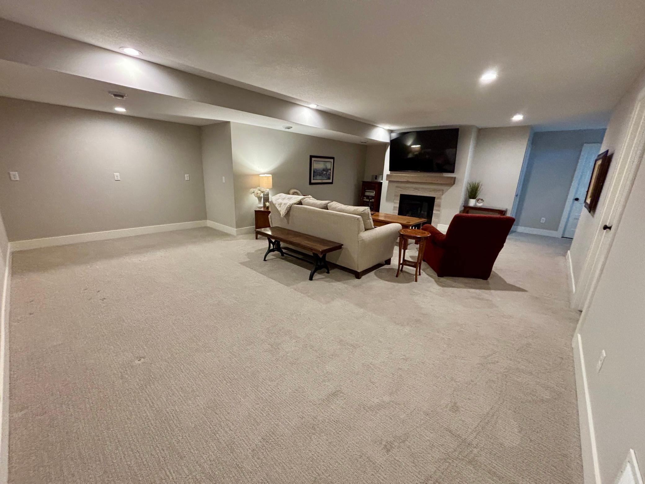 Large lower level. This functional extension enhances the living space with endless possibilities for entertaining and relaxation! All while providing a beautiful space with cozy gas fireplace and separate zone heating and cooling!!