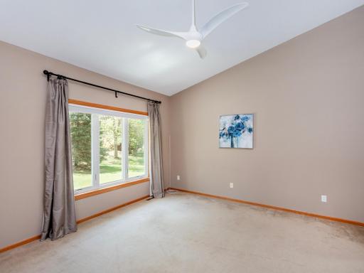 Main level owner's suite with vaulted ceiling, ensuite and walk-in closet.