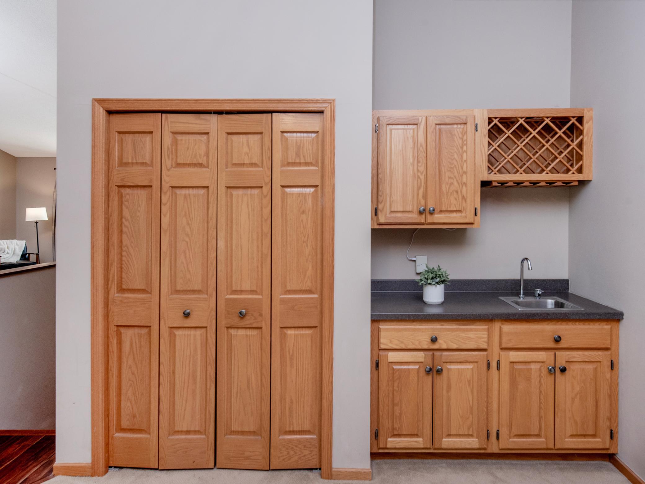 Convenient wet bar just off of the living room and additional closet storage.