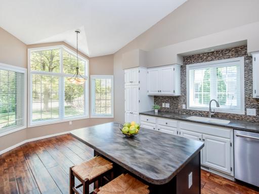 Open-concept kitchen and dining area filled with natural light.