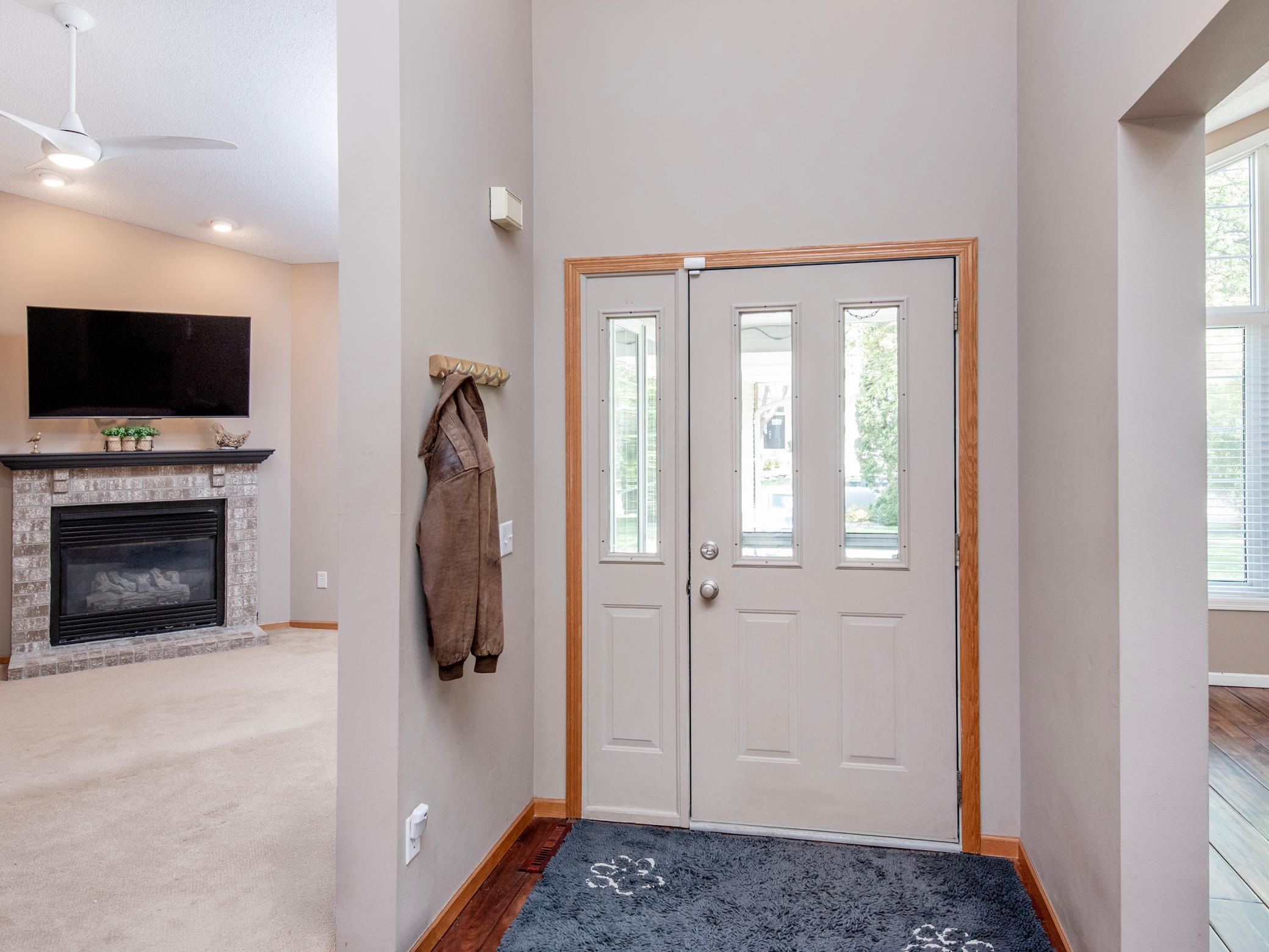 Welcoming entry with abundant natural light and tall ceilings.