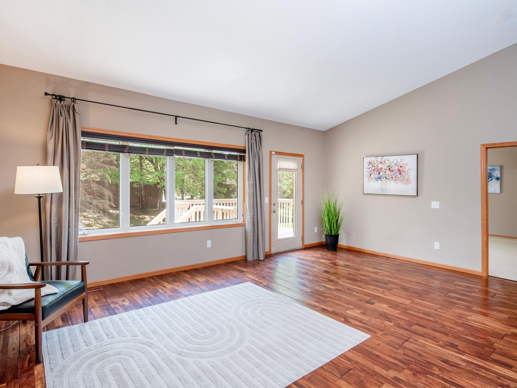 Family room leads to the deck overlooking the private backyard.