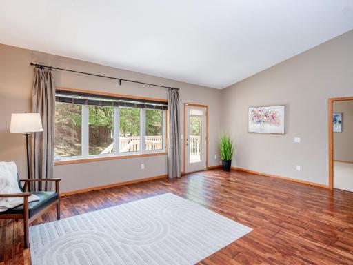 Family room leads to the deck overlooking the private backyard.