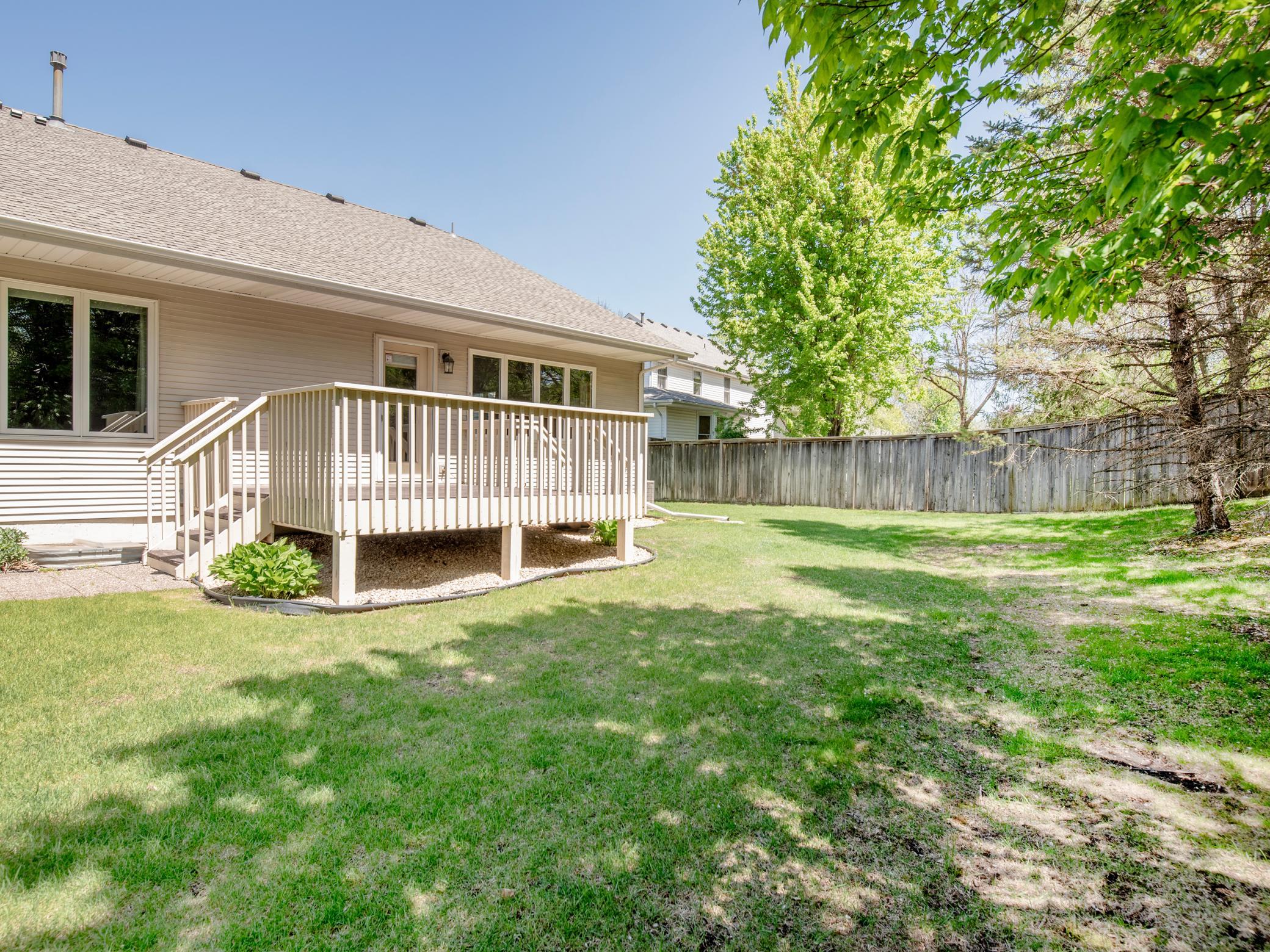 Generous greenspace featuring beautiful mature trees.