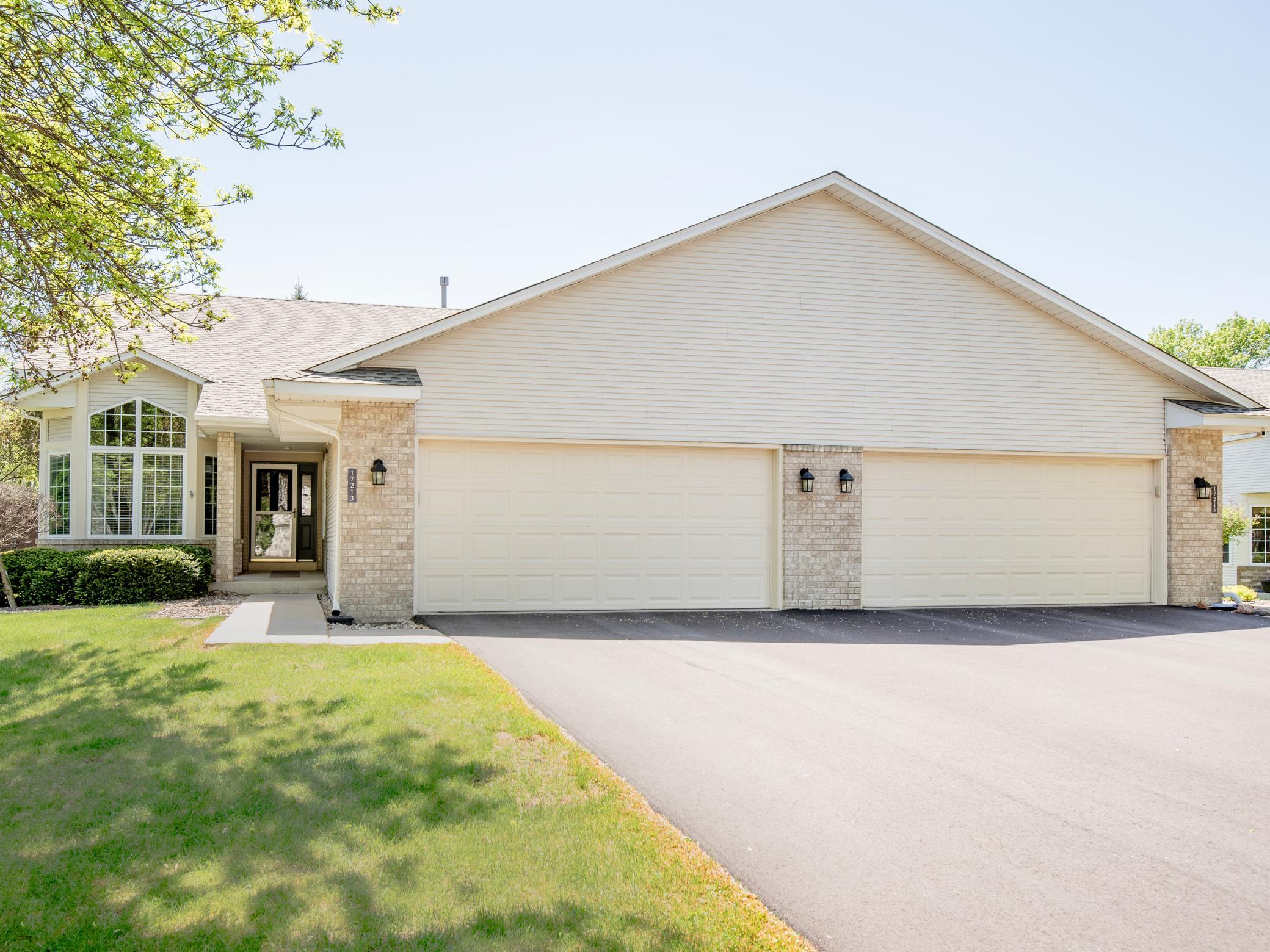 Shared driveway with attached two-car garage.